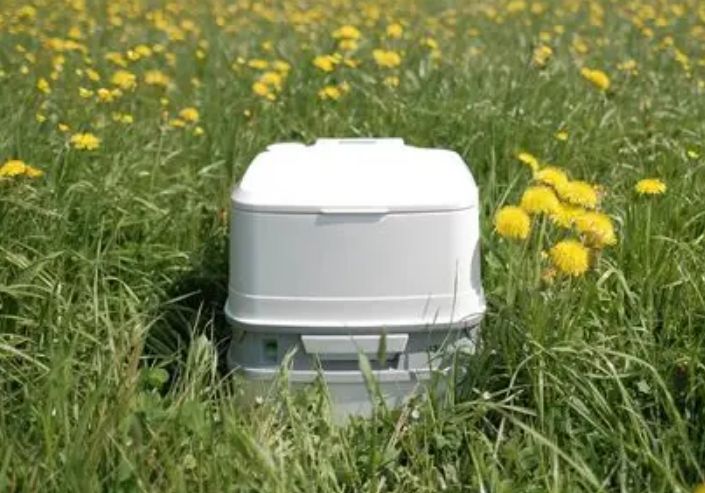 Thetford portable toilet in a field