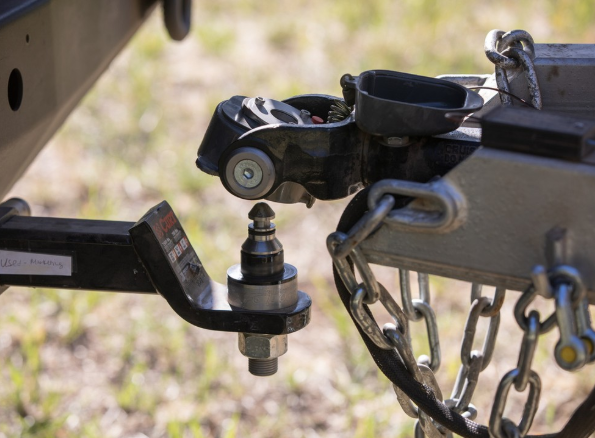 a close up of a DO35 about to be connected to a vehicle with the coupling shown just above the tow pin